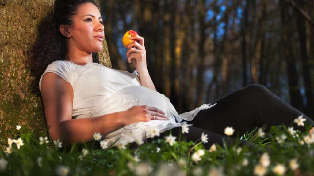 A woman having a passion fruit during pregnancy