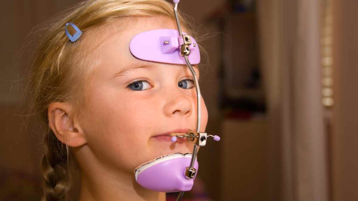 A 6 Years Old Girl Wearing Orthodontic Headgear